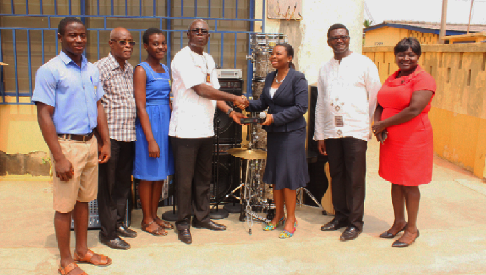 Mr Emmanuel Fiemawule (4th left), Headmaster, St John's Grammar School, receiving the items on behalf of the school from Pastor Dzifa Gakpleazi (5th left), Director of Administration, Royalhouse Chapel International. Picture: NII MARTEY M. 
